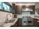 Modern kitchen features stainless steel appliances, granite countertops, and ample cabinet space at 870 Monroe Ne Dr, Atlanta, GA 30308