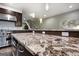 Open kitchen design features stainless steel appliances and a spacious center island with beautiful granite countertops at 870 Monroe Ne Dr, Atlanta, GA 30308