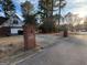 A driveway leading to a well-maintained property with mature trees at 1241 Mount Vernon Dr, Lawrenceville, GA 30044
