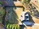 Aerial view of fenced backyard, mature trees, and driveway, showcasing the property's layout and surrounding landscape at 45 George Wynn Rd, Palmetto, GA 30268