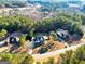 Aerial view of the property, showcasing the neighborhood, lush trees, and proximity to community amenities at 45 George Wynn Rd, Palmetto, GA 30268