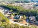 Wide aerial shot of the property, highlighting its location within a neighborhood surrounded by lush greenery and mature trees at 45 George Wynn Rd, Palmetto, GA 30268