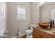 Stylish half bathroom features granite countertop and a vessel sink at 45 George Wynn Rd, Palmetto, GA 30268