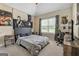 Spacious bedroom with modern decor, carpet floors, and a comfortable gray bed at 45 George Wynn Rd, Palmetto, GA 30268