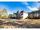 Two-story home with stone accents, white siding, and a spacious front lawn at 45 George Wynn Rd, Palmetto, GA 30268