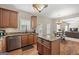 Open-concept kitchen flows into the living space with wood floors, granite countertops, island, and stainless appliances at 45 George Wynn Rd, Palmetto, GA 30268