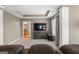 Comfortable living room featuring a tray ceiling and entertainment center at 45 George Wynn Rd, Palmetto, GA 30268