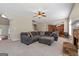 Comfortable living room featuring plush seating, a ceiling fan, and stone fireplace at 45 George Wynn Rd, Palmetto, GA 30268