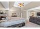 Large main bedroom boasts of a ceiling fan and a sitting area at 45 George Wynn Rd, Palmetto, GA 30268