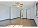 A bedroom featuring wood-look tile flooring, a ceiling fan, and natural lighting at 6187 Radford Dr, Riverdale, GA 30296