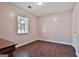 A room with hardwood floors and natural lighting at 6187 Radford Dr, Riverdale, GA 30296