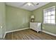 A room with hardwood floors, a ceiling fan, and natural lighting at 6187 Radford Dr, Riverdale, GA 30296