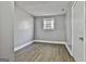 A room with hardwood floors and natural lighting at 6187 Radford Dr, Riverdale, GA 30296