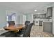 Kitchen and dining area with stylish tile floors and modern appliances at 6187 Radford Dr, Riverdale, GA 30296