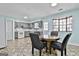 Open dining area adjoining the kitchen, perfect for Gathering gatherings and entertaining guests at 6187 Radford Dr, Riverdale, GA 30296
