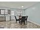 Eat-in kitchen area with cozy dining table set and updated cabinetry at 6187 Radford Dr, Riverdale, GA 30296