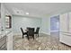 Convenient kitchen and dining space with updated appliances and a view of the adjacent living area at 6187 Radford Dr, Riverdale, GA 30296
