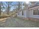 Charming home featuring a brick pathway and light blue siding at 6187 Radford Dr, Riverdale, GA 30296