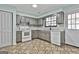 Renovated kitchen boasts ample cabinet space and updated appliances for a contemporary look at 6187 Radford Dr, Riverdale, GA 30296