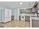 Spacious kitchen featuring granite counters and updated appliances at 6187 Radford Dr, Riverdale, GA 30296