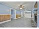 Open living room with a stone fireplace and access to additional areas at 6187 Radford Dr, Riverdale, GA 30296