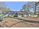 Exterior rear view of home with fenced yard at 6187 Radford Dr, Riverdale, GA 30296