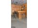 Basement bar area has a wooden bar with seating and wood walls at 35 Abelia Dr, Covington, GA 30014