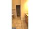Bathroom featuring tile flooring, a bathtub, and a wooden vanity at 35 Abelia Dr, Covington, GA 30014