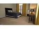 Cozy bedroom featuring a comfortable bed, plush carpeting, and natural light from a large window at 35 Abelia Dr, Covington, GA 30014