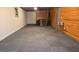 Living room includes wood walls and custom carpet at 35 Abelia Dr, Covington, GA 30014