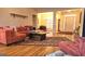 Bright and airy living room with hardwood floors, a large sectional sofa, and an open layout at 35 Abelia Dr, Covington, GA 30014