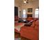 Cozy living room highlighting hardwood floors, comfortable seating, a brick fireplace, and stylish decor at 35 Abelia Dr, Covington, GA 30014