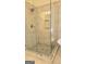 Shower room includes glass shower with a built-in seat and tile floors at 35 Abelia Dr, Covington, GA 30014