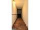 Wooden stairs lead down to a finished basement at 35 Abelia Dr, Covington, GA 30014