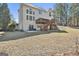 Expansive backyard view featuring a two-story deck and ample green space, ideal for outdoor activities at 44 Willow Leaf Way, Sharpsburg, GA 30277