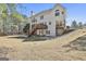 Wide backyard view showcasing a spacious layout, with the two-story deck, perfect for entertaining at 44 Willow Leaf Way, Sharpsburg, GA 30277