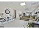 Finished basement with neutral carpet, built-in shelving, and a large seating area at 44 Willow Leaf Way, Sharpsburg, GA 30277