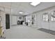 Finished basement with a dedicated desk area, bright light, and a walkout exit at 44 Willow Leaf Way, Sharpsburg, GA 30277