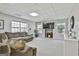 Finished basement with cozy seating, bright windows, and a neutral color palette at 44 Willow Leaf Way, Sharpsburg, GA 30277