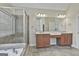 Primary bathroom showcasing a double vanity, walk-in shower, and soaking tub at 44 Willow Leaf Way, Sharpsburg, GA 30277