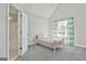 Bedroom features a large window and a private bathroom with a shower/tub combo at 44 Willow Leaf Way, Sharpsburg, GA 30277