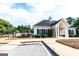 Community clubhouse featuring a charming exterior with well-maintained landscaping and easy access at 44 Willow Leaf Way, Sharpsburg, GA 30277