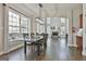 Dining room area with connecting living room and fireplace, beautiful windows and lots of natural light at 44 Willow Leaf Way, Sharpsburg, GA 30277