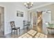 Open-concept interior with hardwood floors, barn doors, and stylish lighting at 44 Willow Leaf Way, Sharpsburg, GA 30277