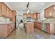Large open kitchen features modern appliances, hardwood floors, island and custom cabinets at 44 Willow Leaf Way, Sharpsburg, GA 30277