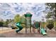 Community playground with various play structures for entertainment and recreation at 44 Willow Leaf Way, Sharpsburg, GA 30277