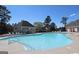 Community pool with gazebo surrounded by lounge chairs and ample seating for residents to enjoy at 44 Willow Leaf Way, Sharpsburg, GA 30277