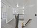 Upstairs hallway with view of staircase at 44 Willow Leaf Way, Sharpsburg, GA 30277