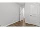 Bedroom with two doors, a modern aesthetic, and wood-look floors at 7234 Crestside Dr # 81, Austell, GA 30168