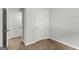 Bedroom featuring two doors and wood-look floors at 7234 Crestside Dr # 81, Austell, GA 30168